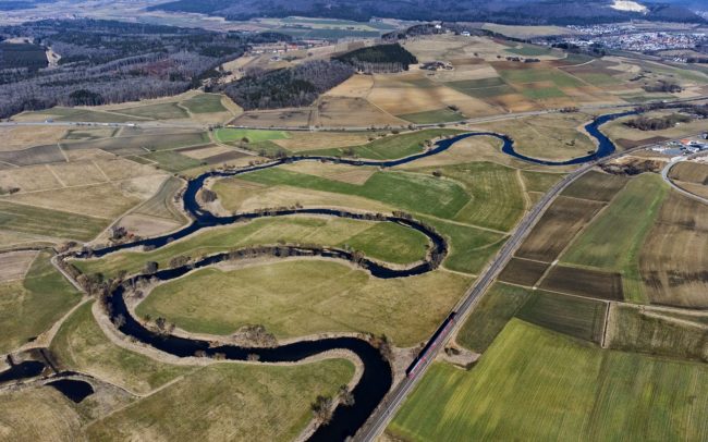 The Danube begins to bear its name only after the merger of the Breg and Brigach springs. This connection is established beyond Donaueschingen and soon the first bends appear on our river, which here is still only a thin stream. Neudingen and Geisingen, Germany.